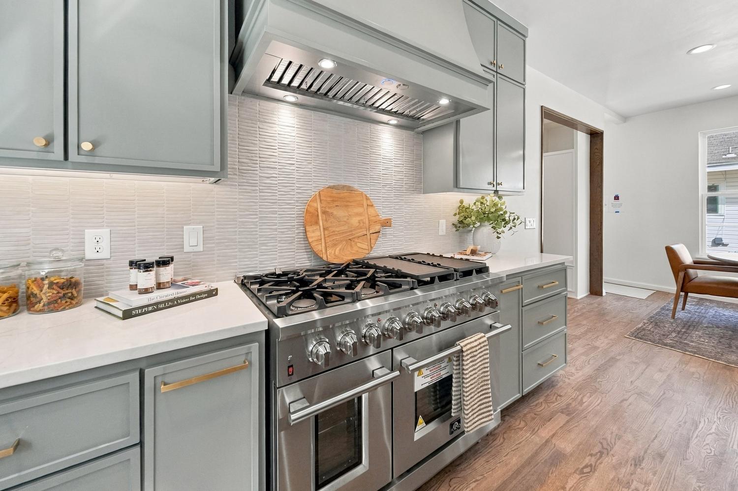 Professional range with tile backsplash